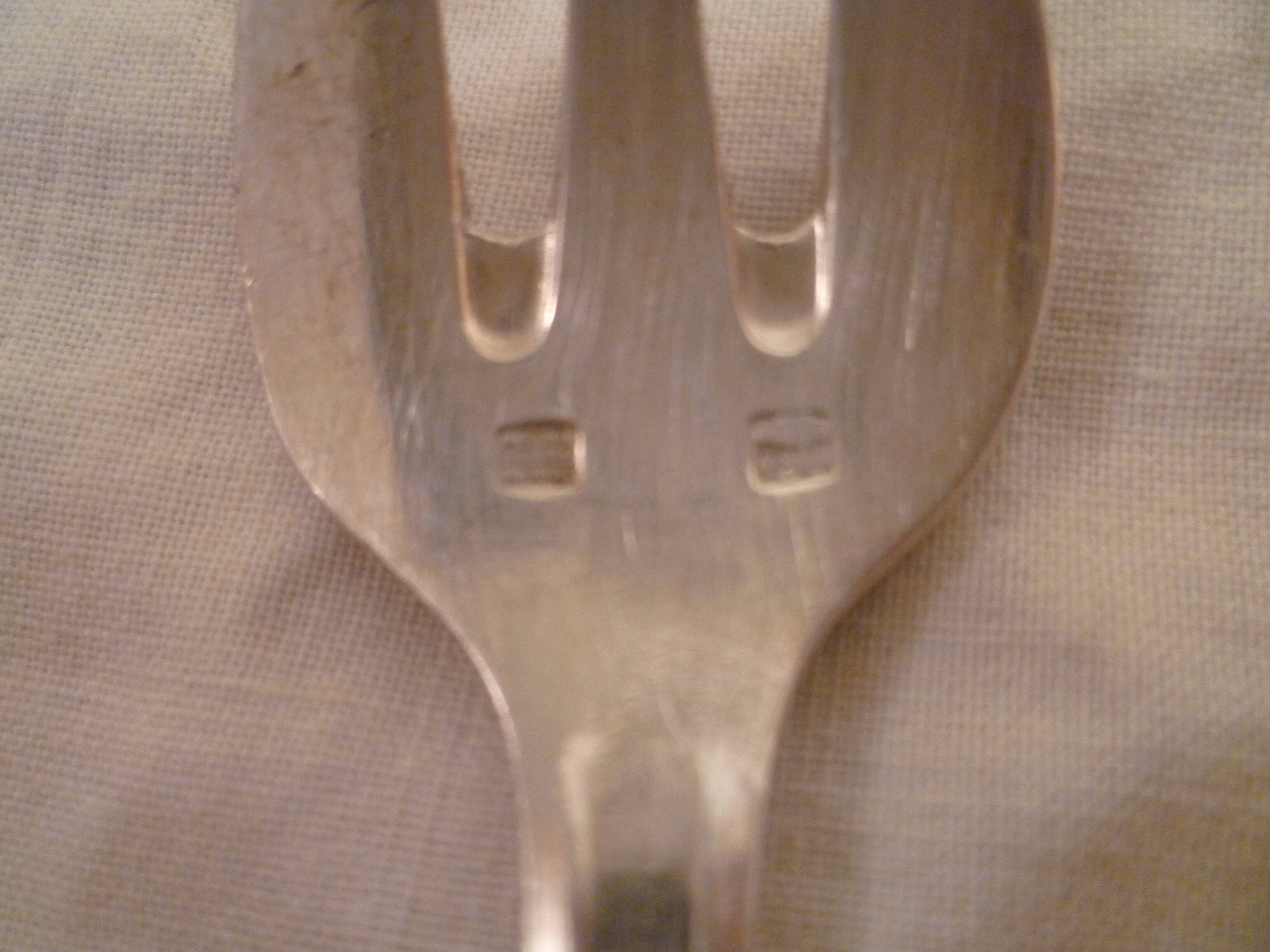 Set of 9 art deco silver oyster forks