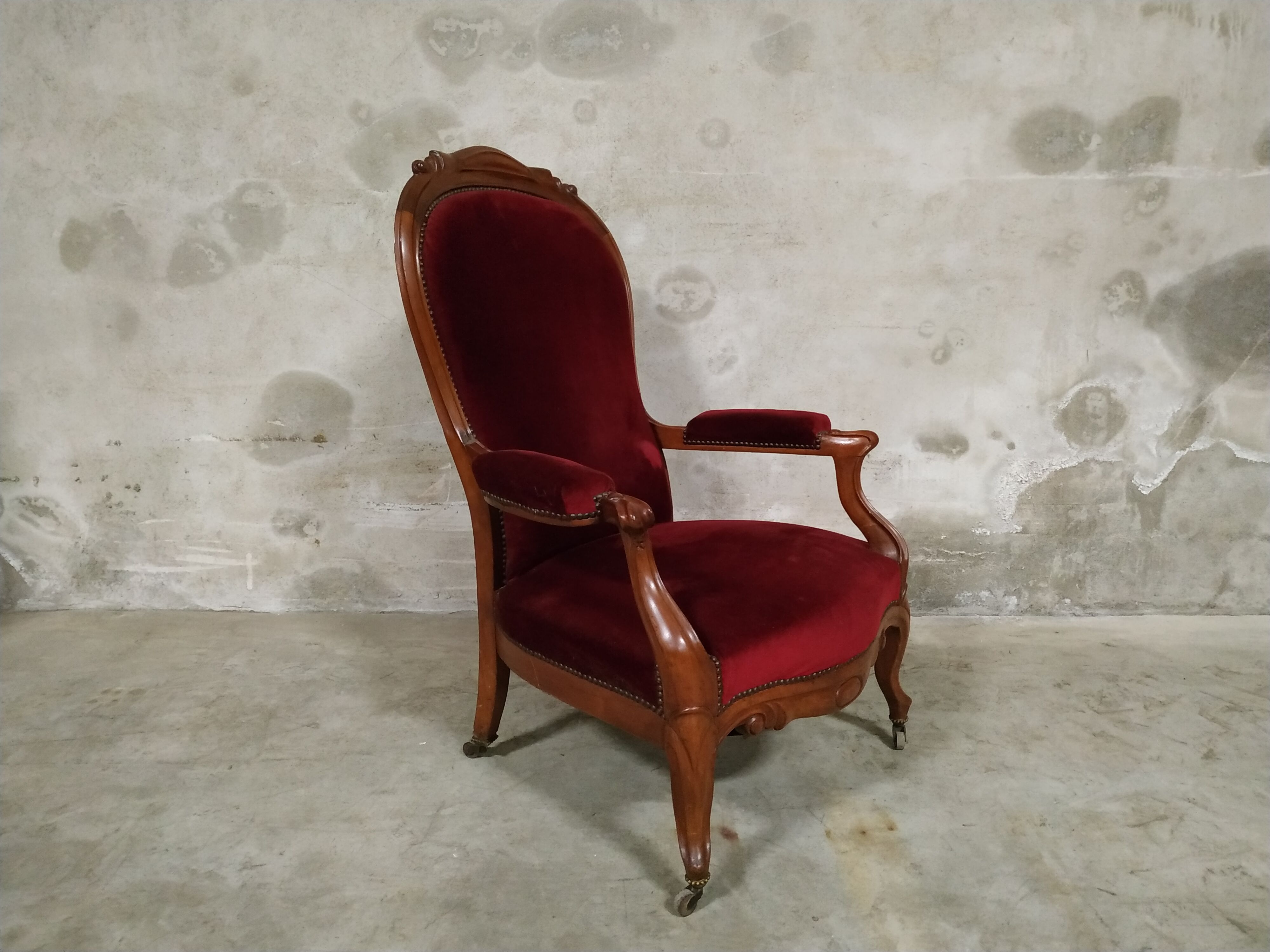 Walnut and velvet armchair