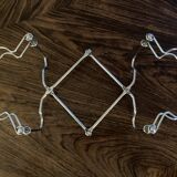 Chrome metal trivet by Tomado Holland
