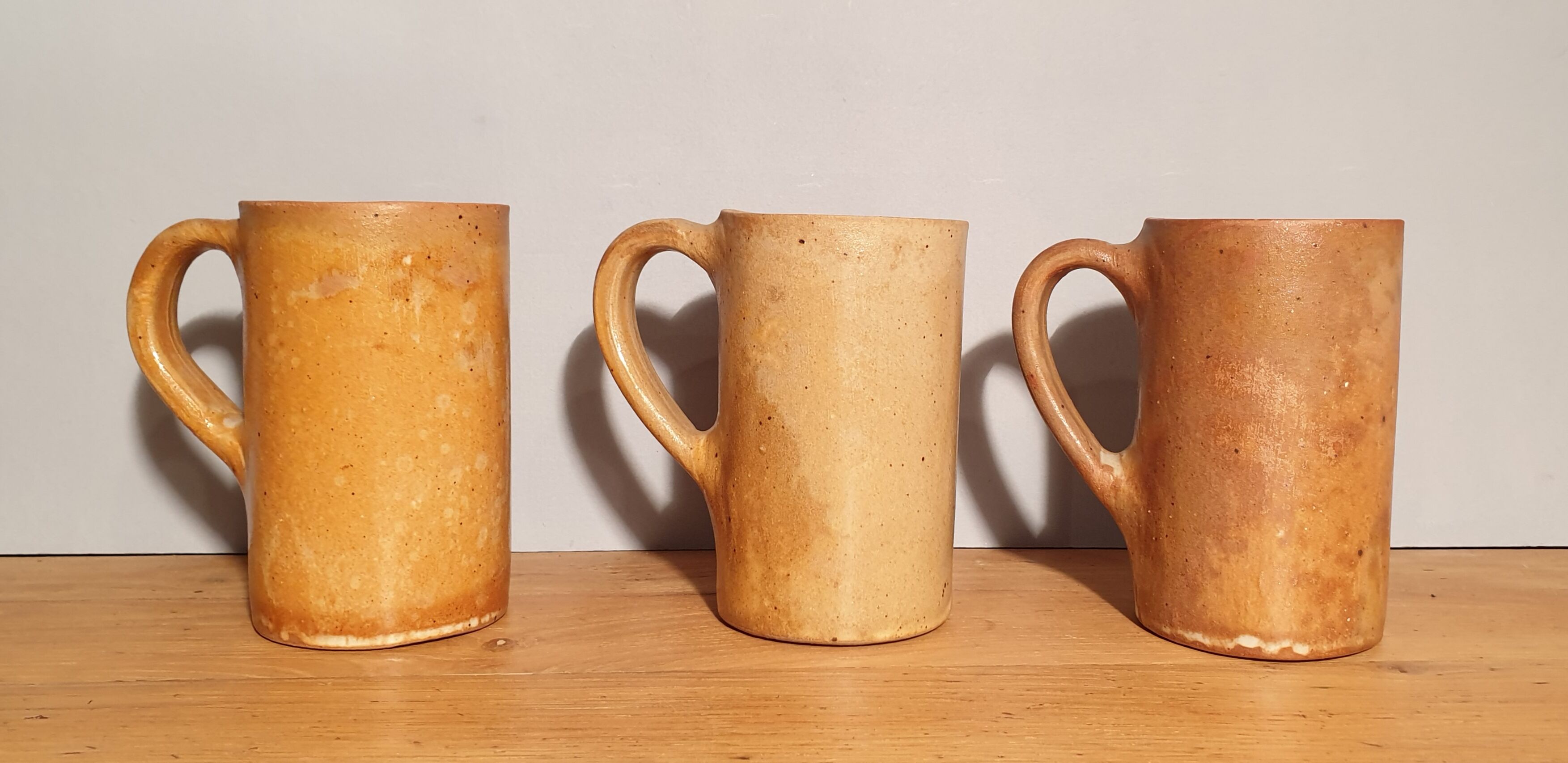 Set of three large sandstone mugs