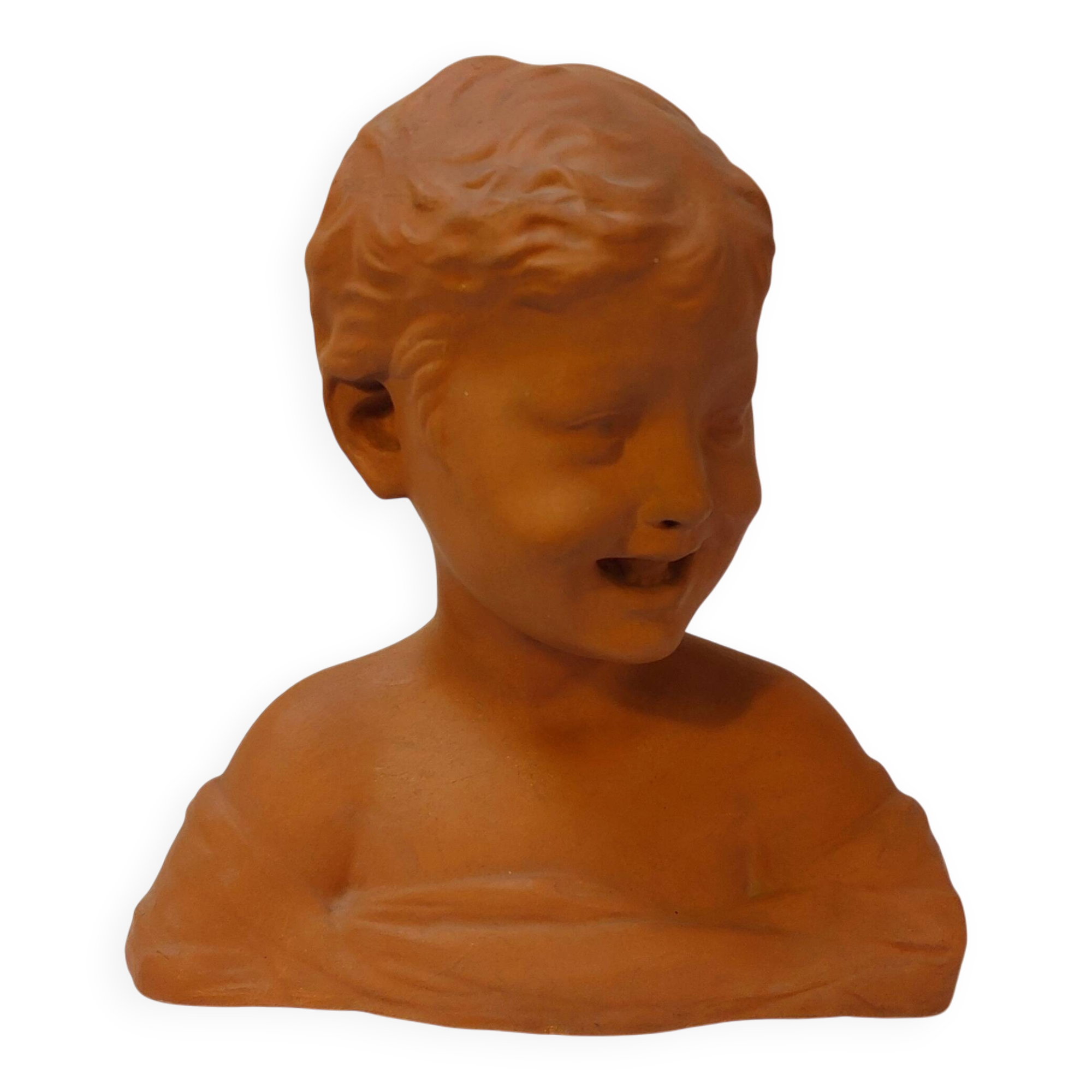 Terracotta bust of a smiling little boy.
