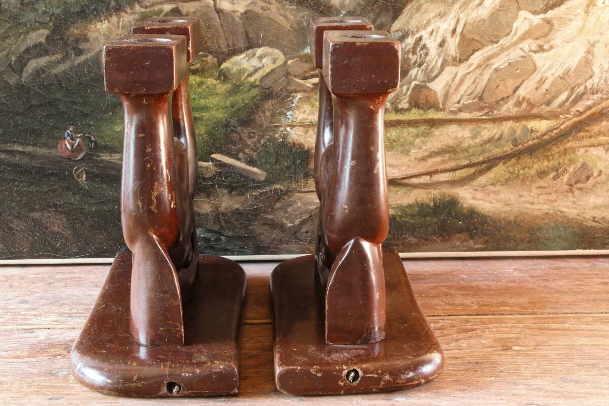 Pair of Art Deco carved wood candlesticks, signed Delaporte