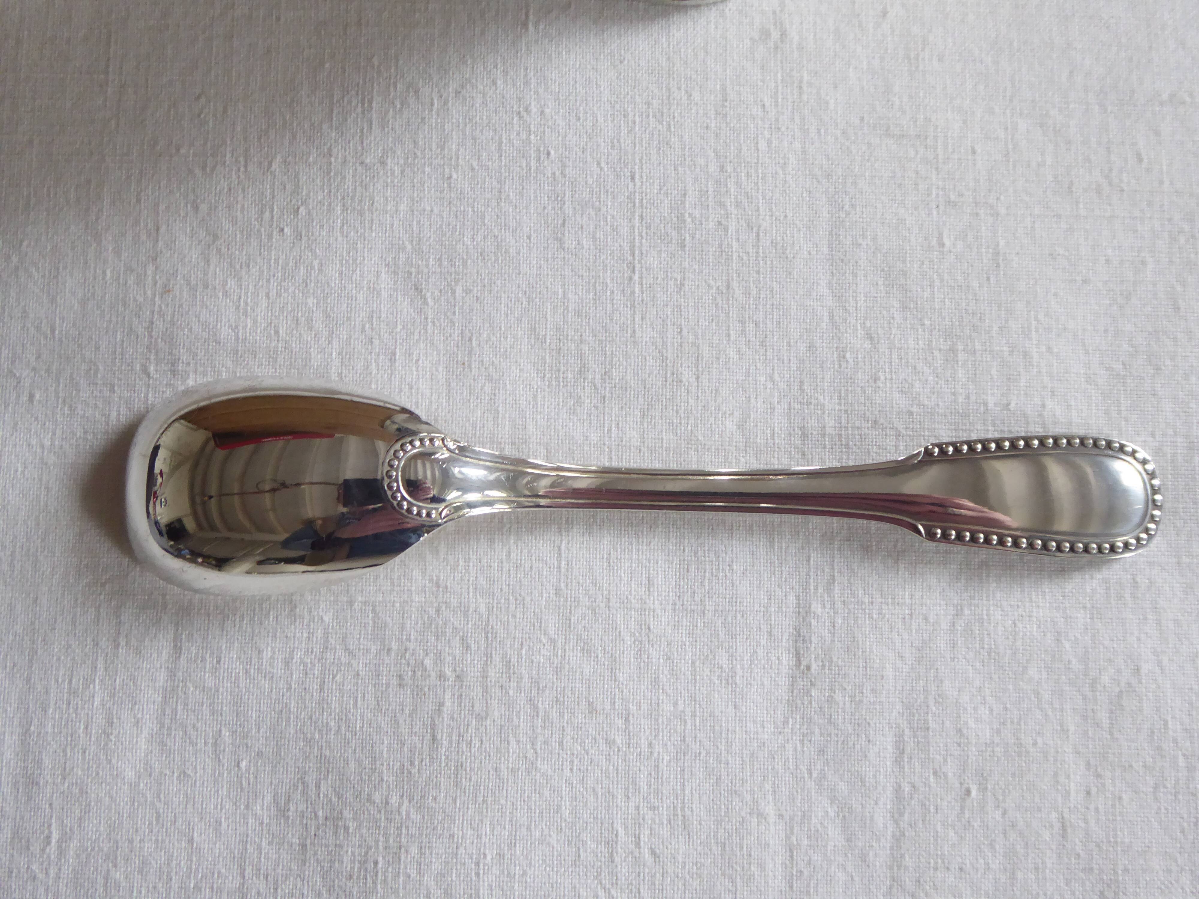 Cockerel + silver metal spoon