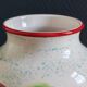 White Ceramic Vase with Peach and Leaf Motifs
