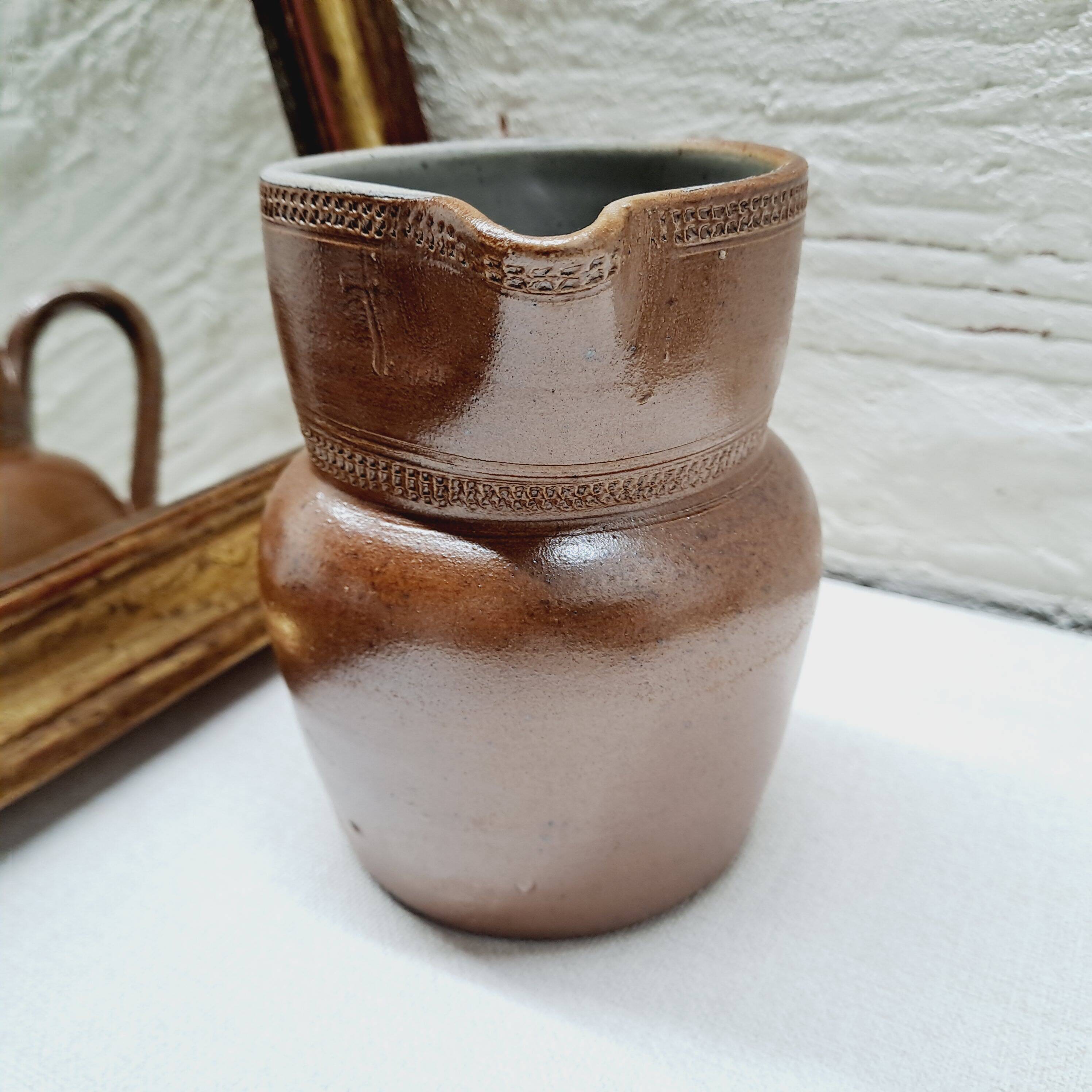 Antique stoneware milk jug