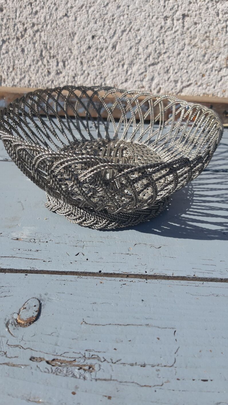 flat basket cut center table in woven metal