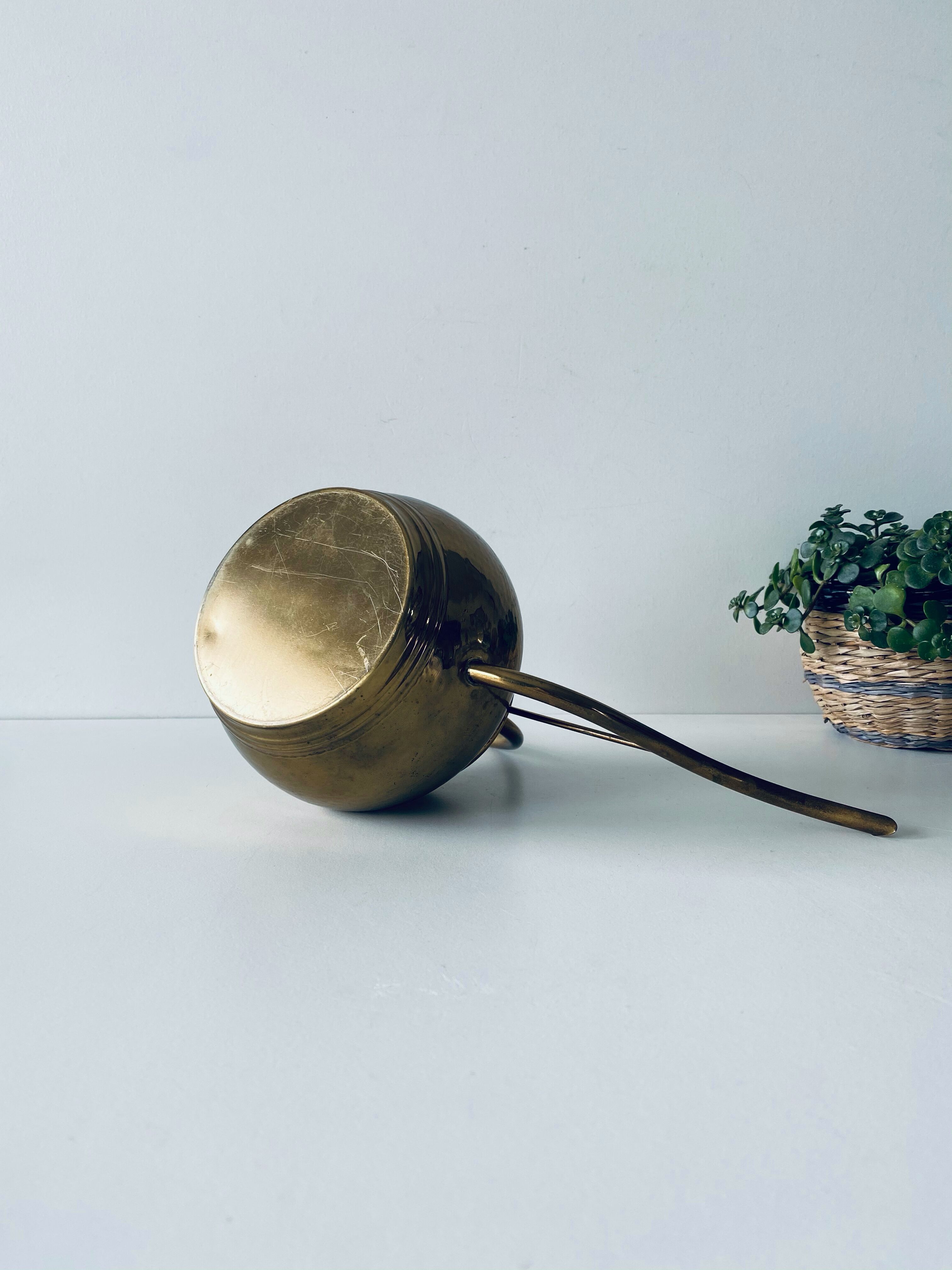 Old brass watering can
