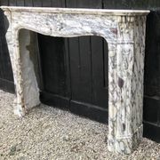 Cheminée en marbre brèche violette de style Louis XV