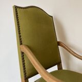 Olive green upholstered armchairs with studs