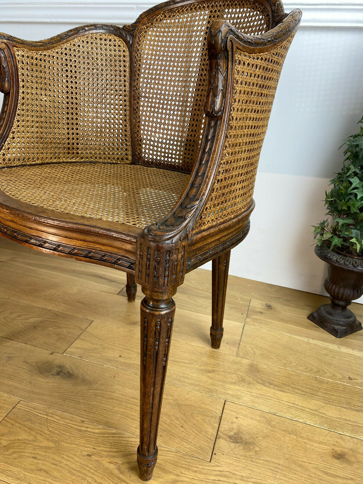 Old armchair with double cannage in walnut carved style Louis XVI of the nineteenth century