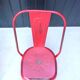 Pair of red stackable metal chairs