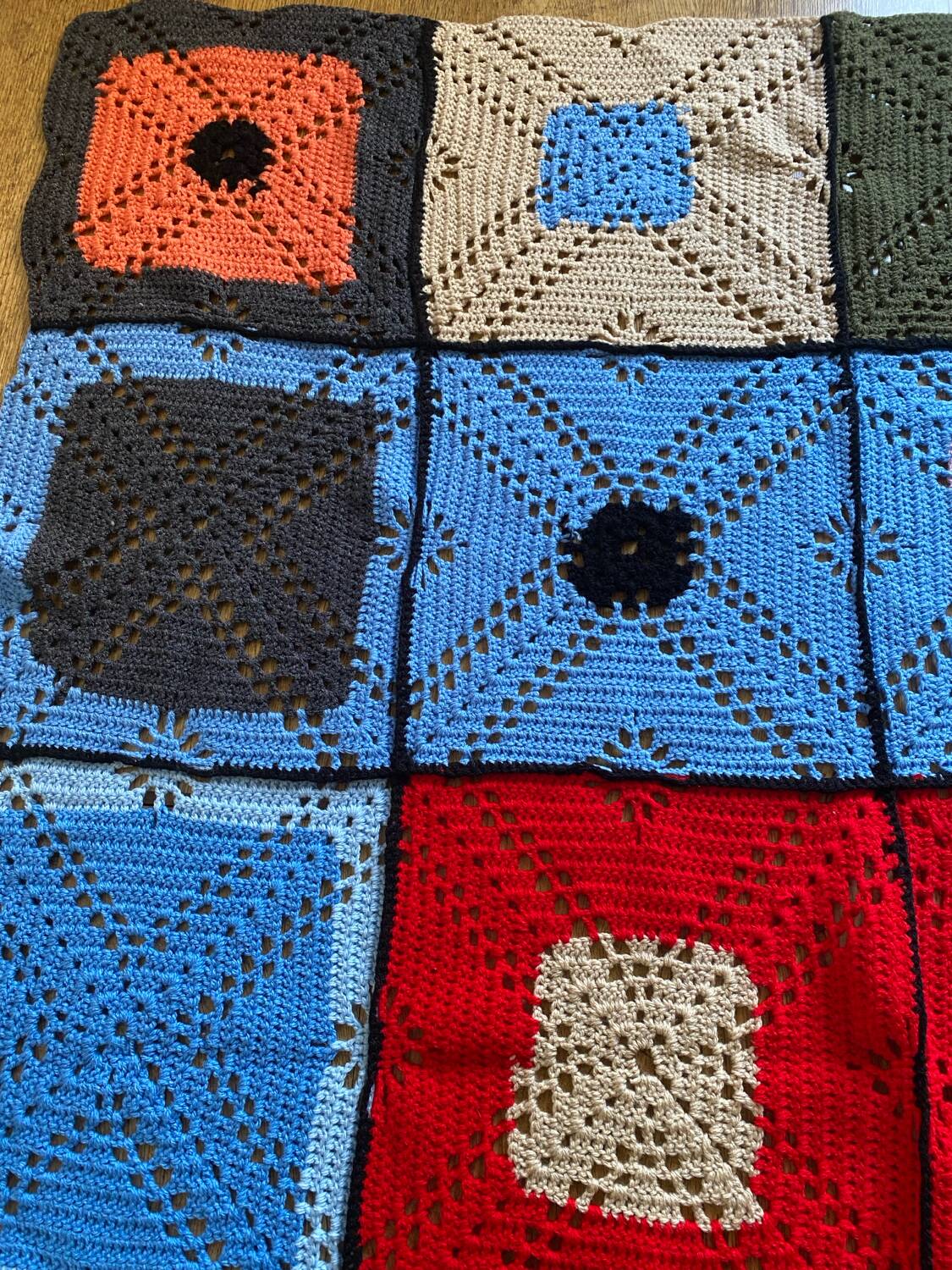 Hand-knitted patchwork blanket