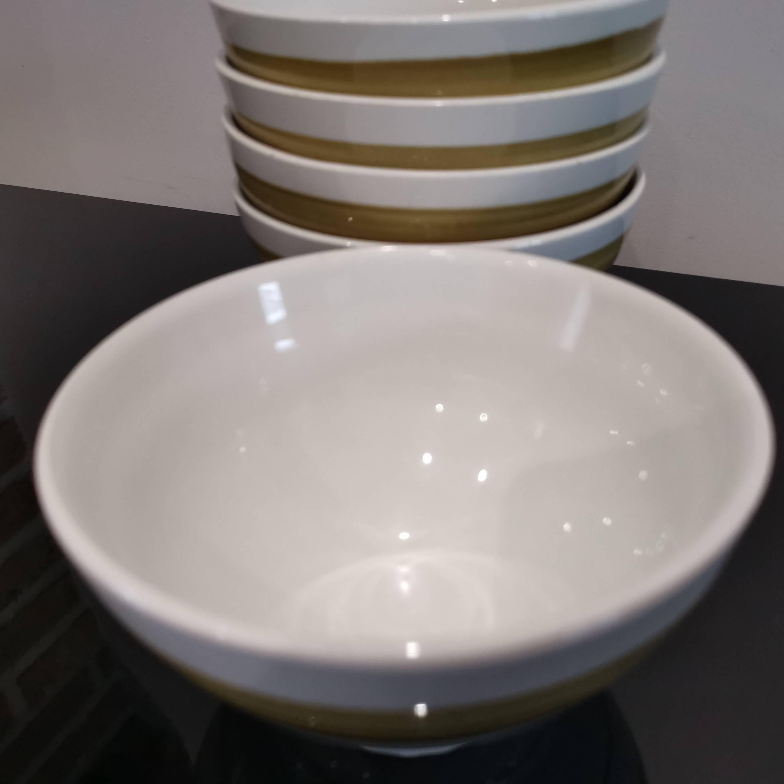 Series of 5 small old earthenware bowls with olive green edging