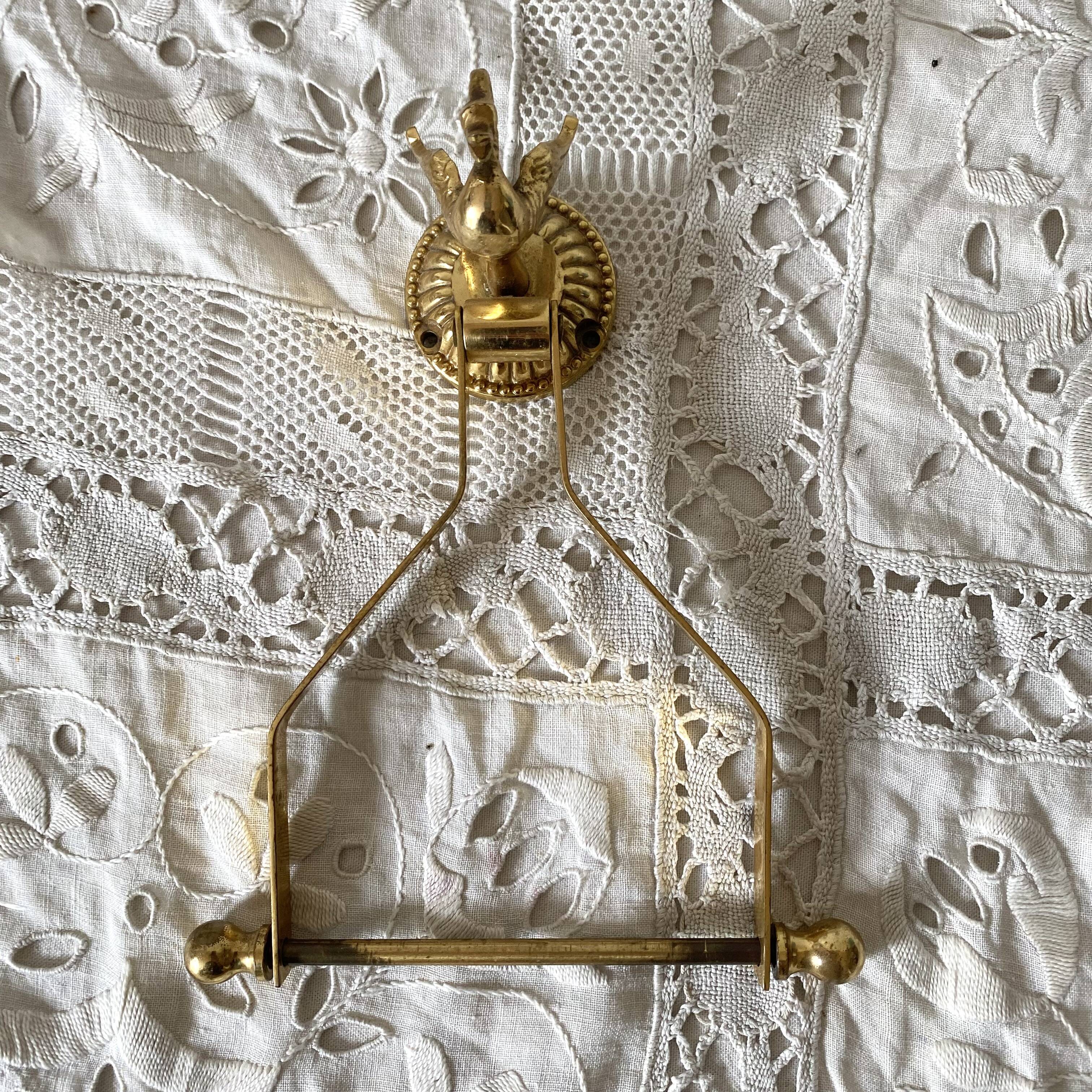 Swan toilet paper dispenser in brass