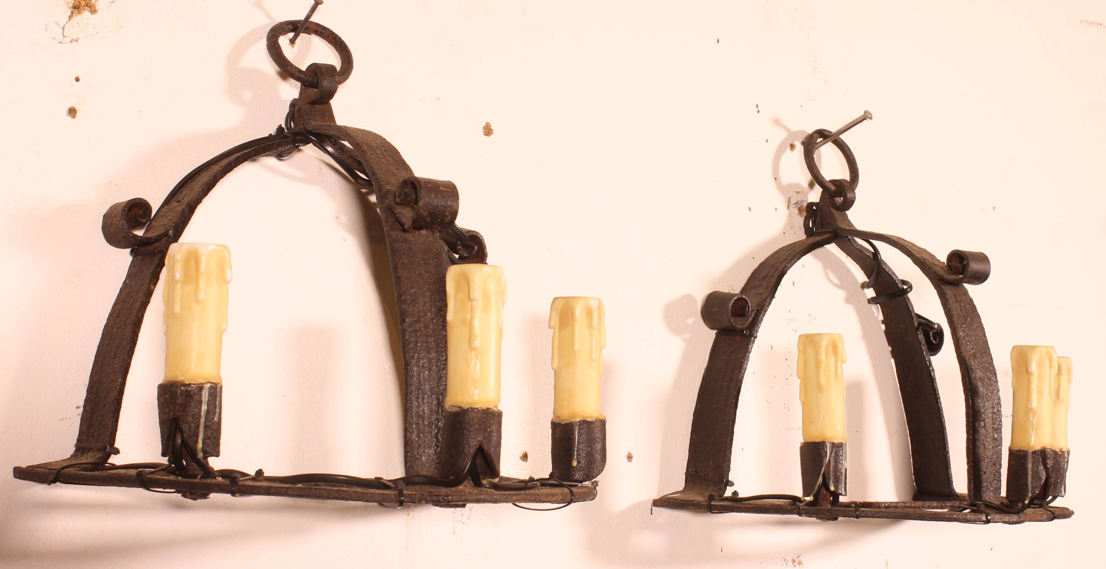 Pair of wrought iron wall sconces in medieval style