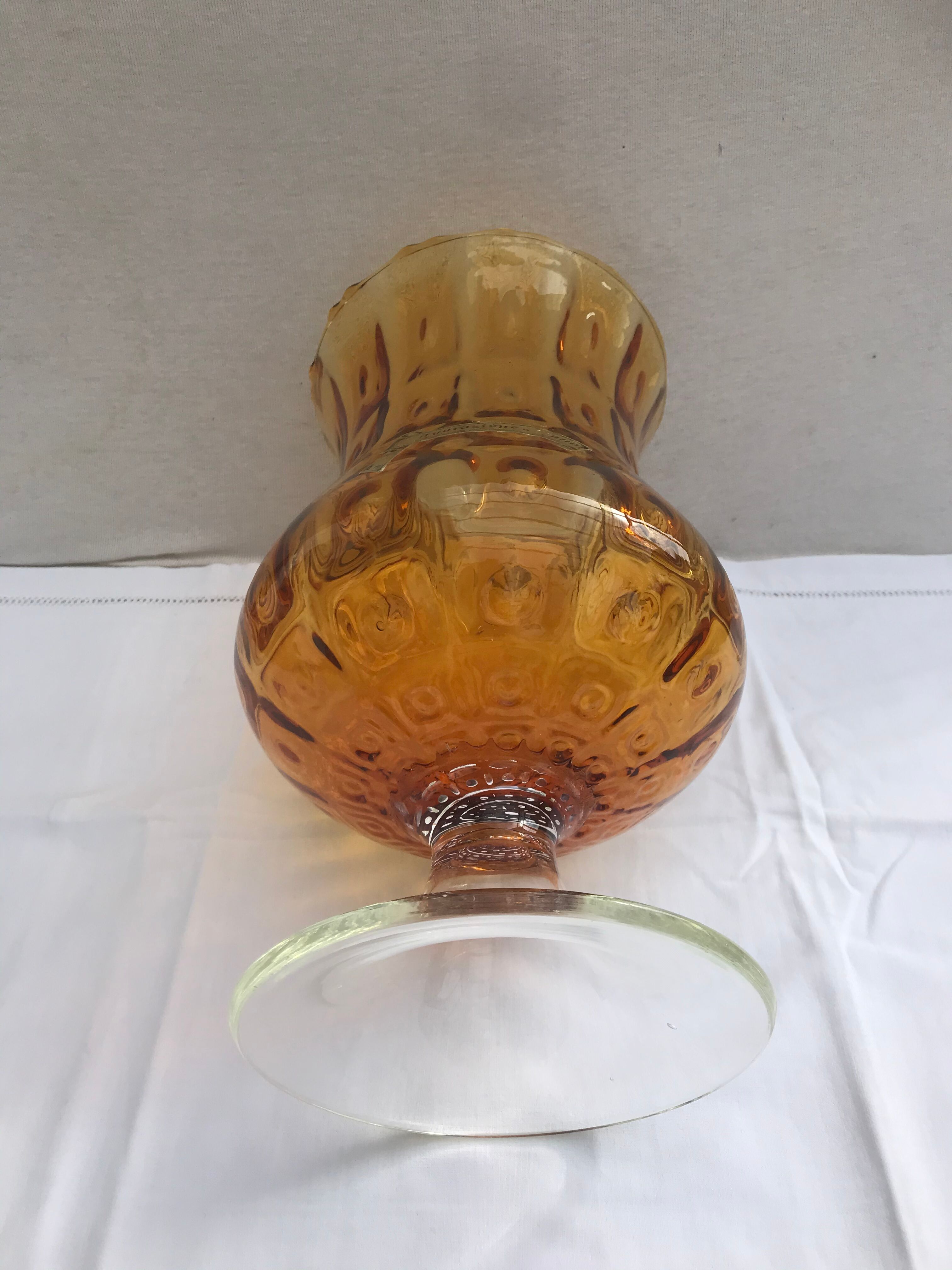 Ancient vase on foot orange glass