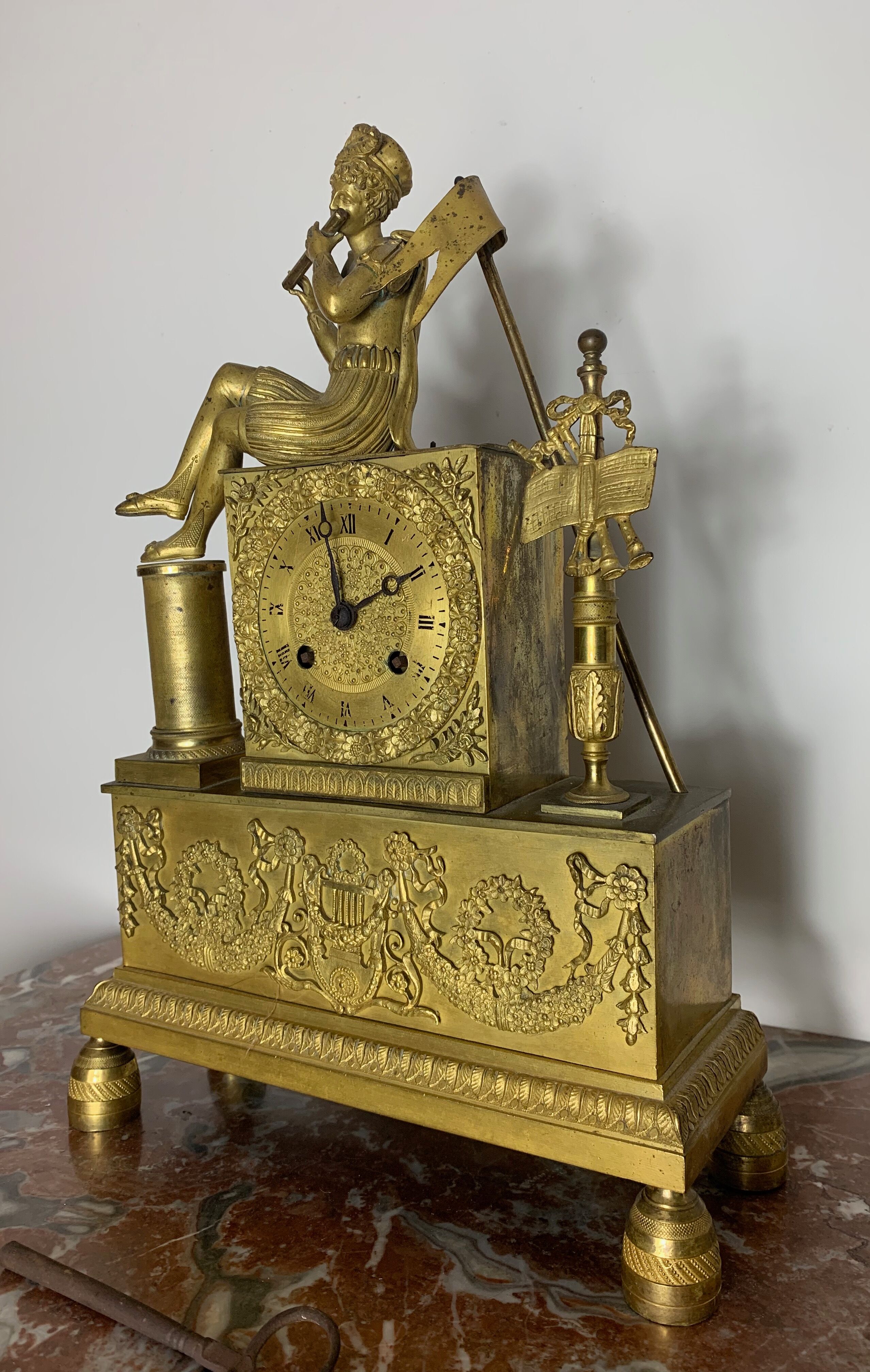Period clock restoration in gilded bronze