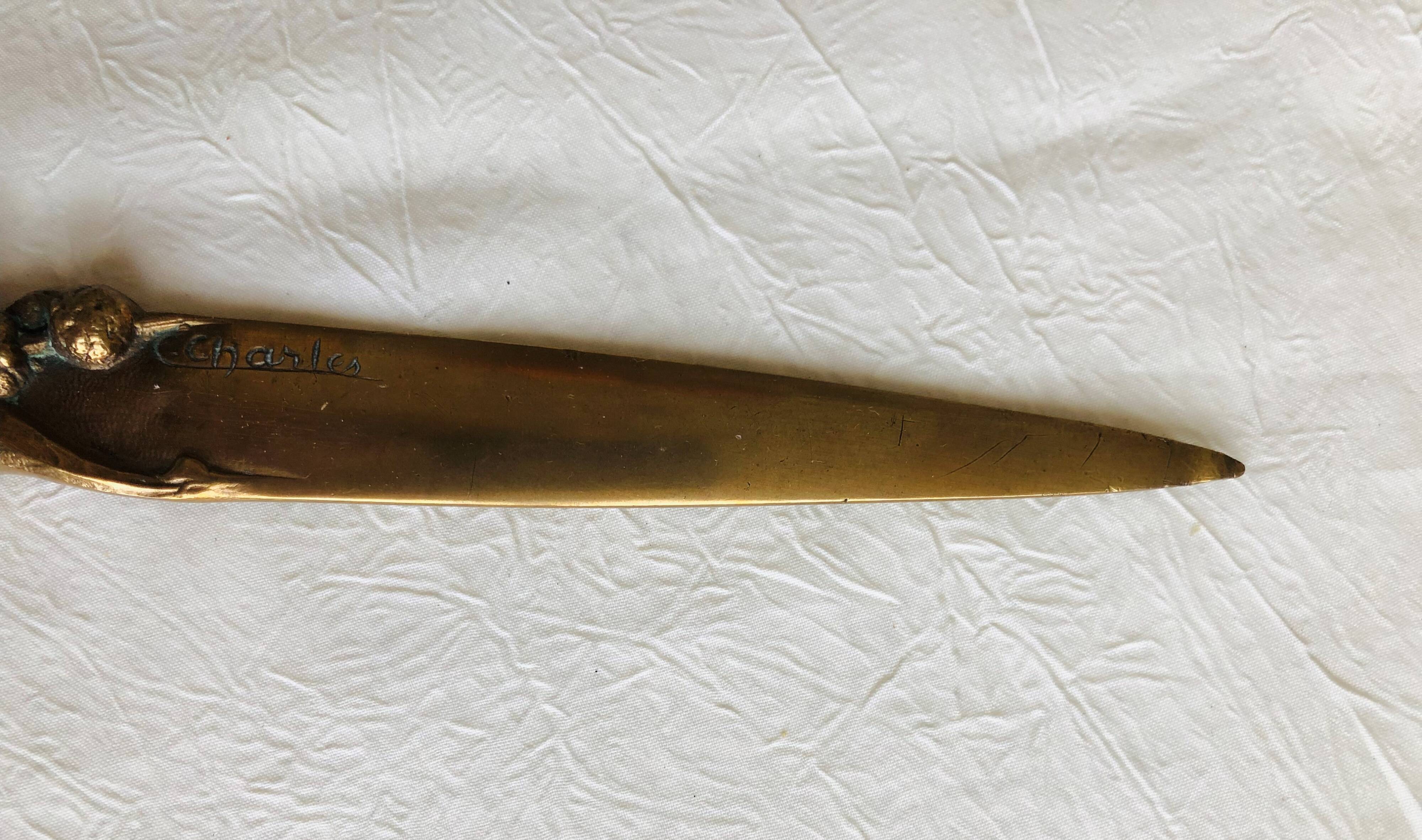 Opens letters cut bronze paper signed