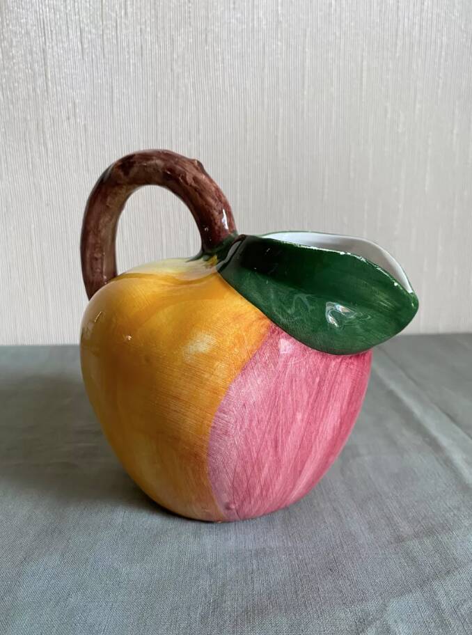Earthenware pitcher evoking a fruit