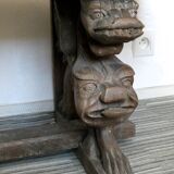 Gothic bench made of solid wood, heads of carved grotesques