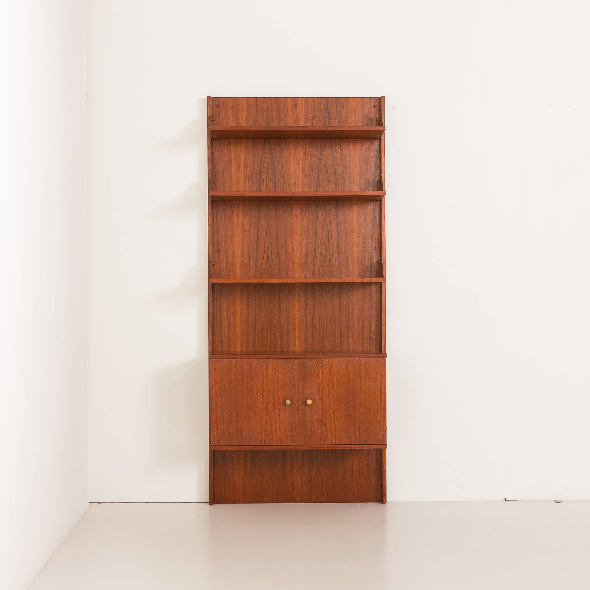 Italian mid-century teak wall unit on panels, 1970s