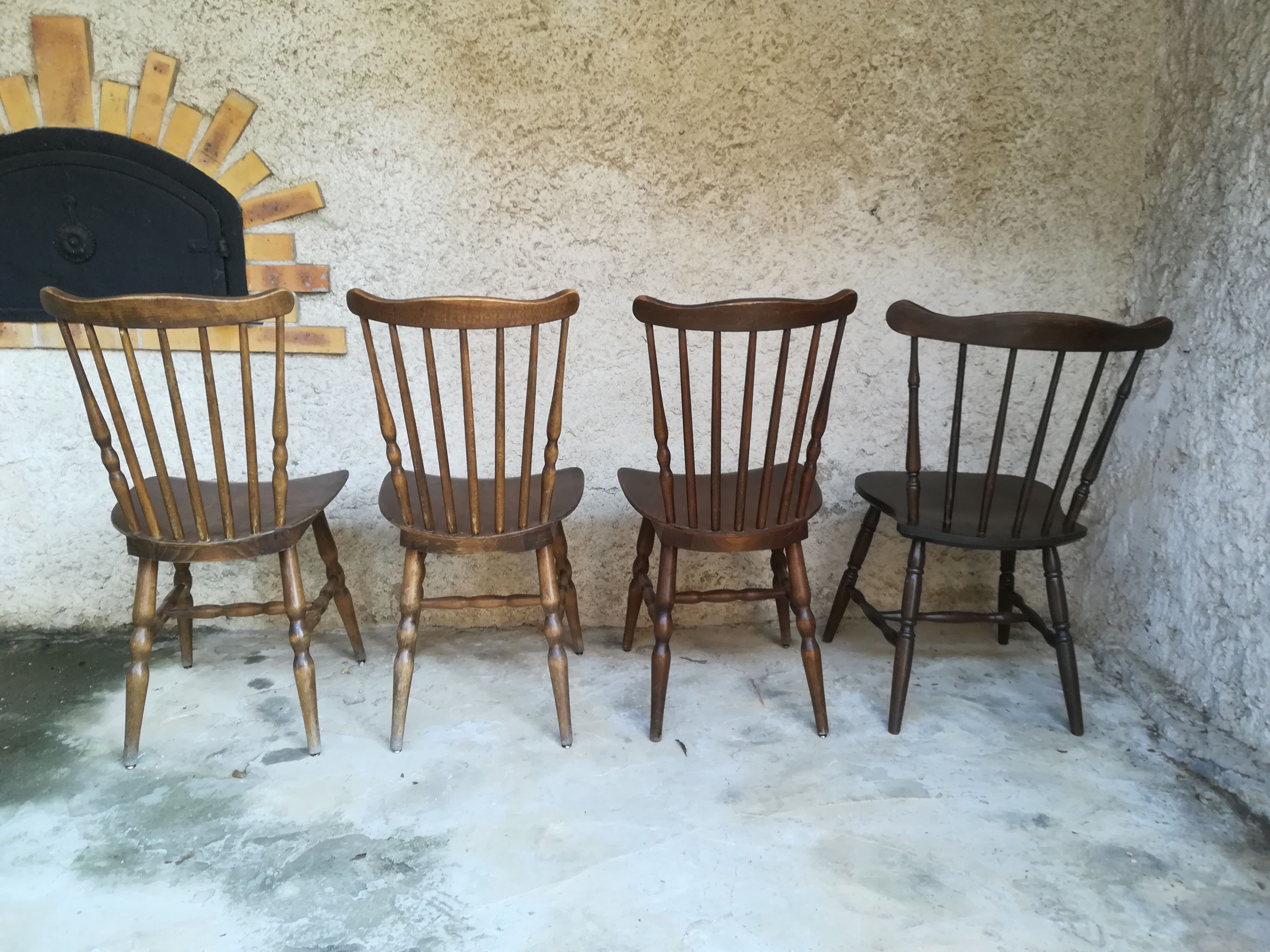 Eight mismatched bistro chairs