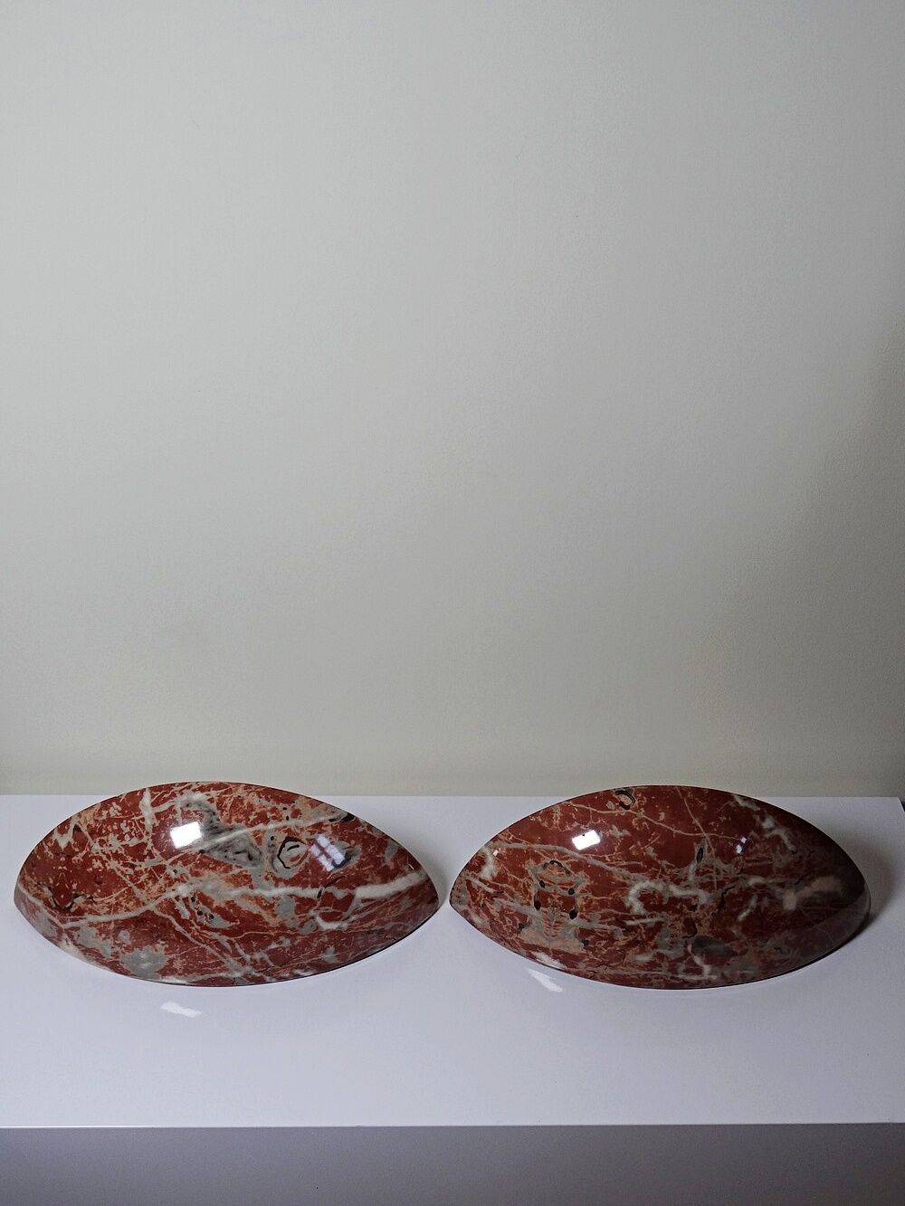 Pair of vintage wall sconces in faux red marble ceramic, 1990s.