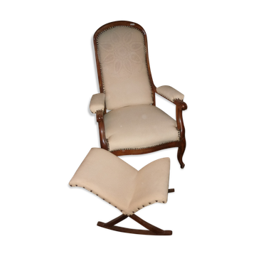 Armchair and its footrest