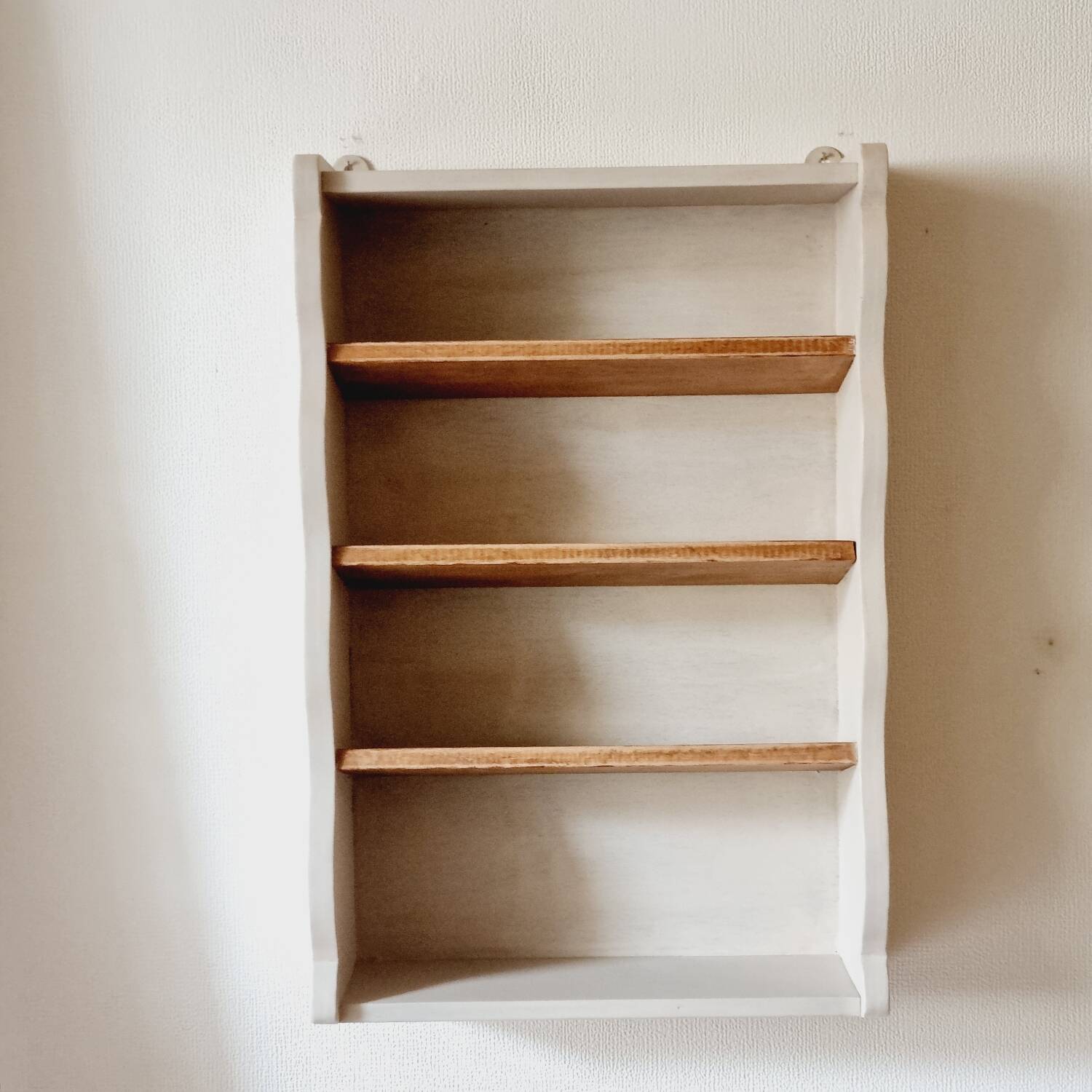 Linen-colored wooden shelf