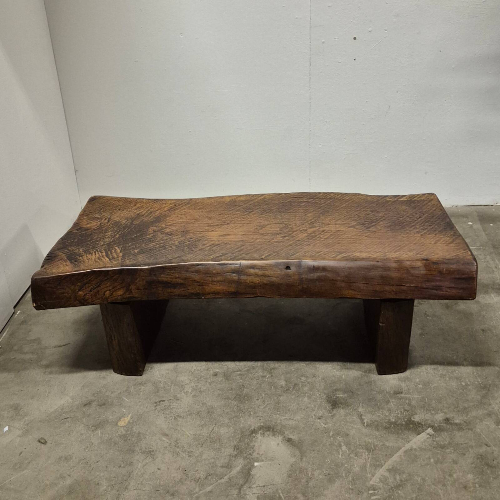 Rustic solid oak coffee table with a one piece top, France 1950s