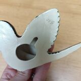 Two exotic birds in slip to hang