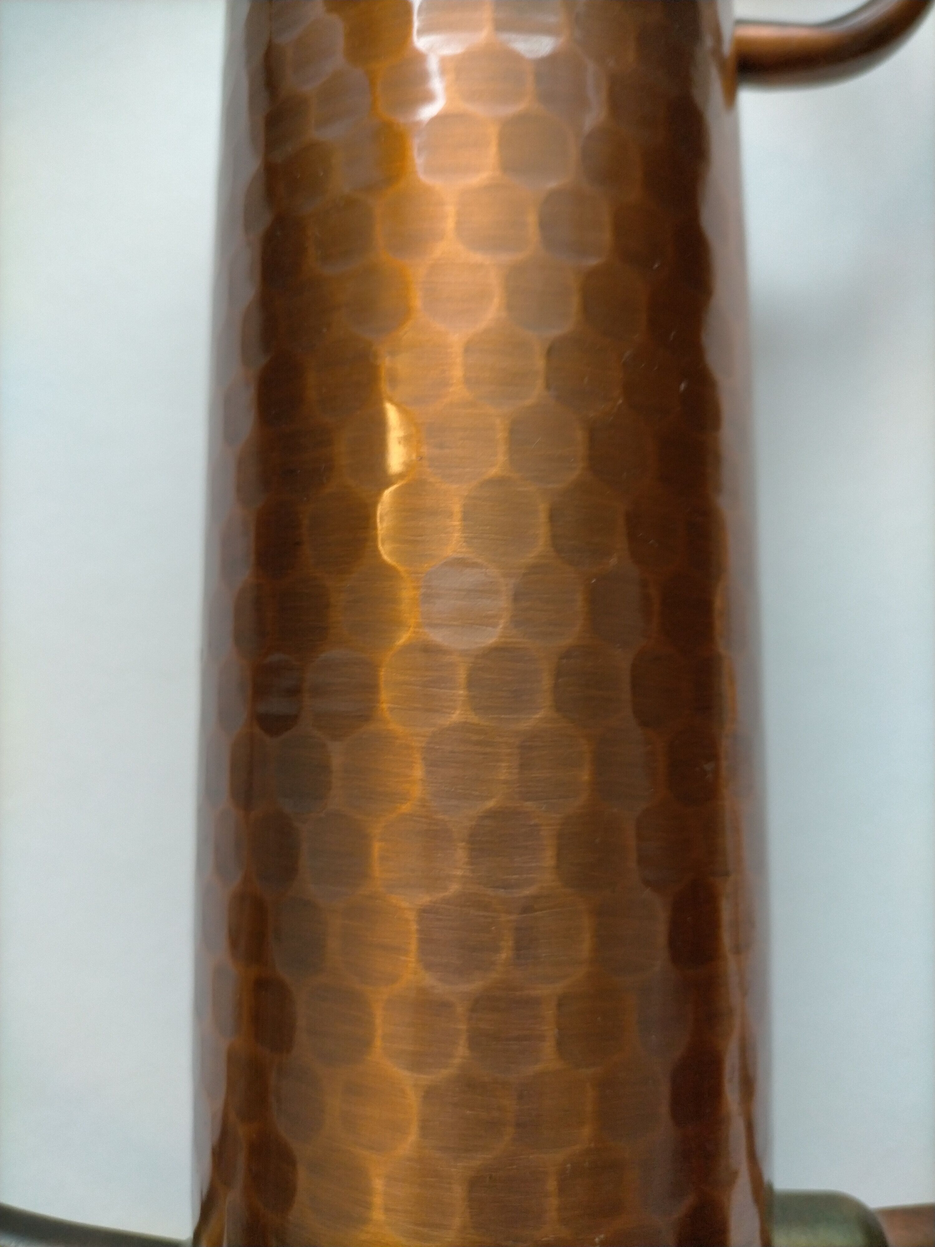 Hammered copper watering can