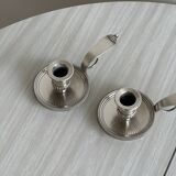 Pair of shiny silver metal candlesticks