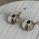 Pair of shiny silver metal candlesticks