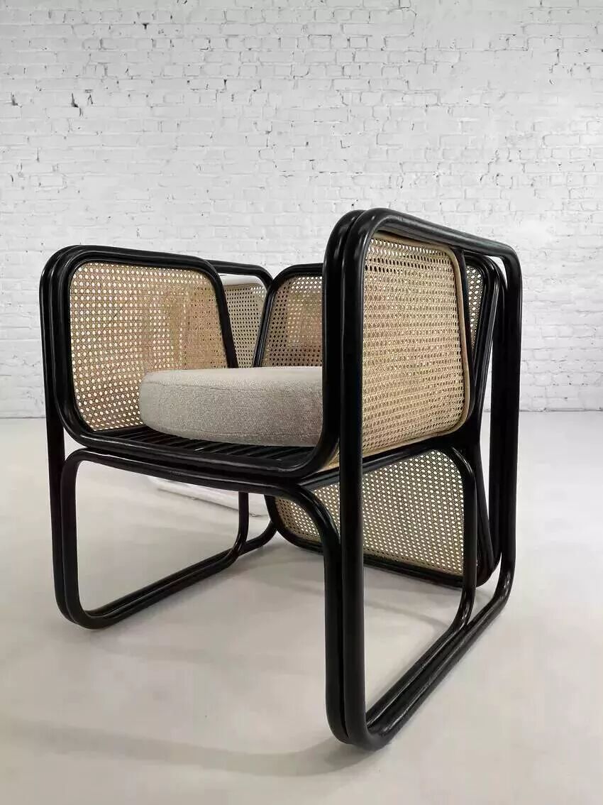 Cubic armchair in black rattan and canework