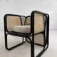 Cubic armchair in black rattan and canework