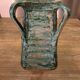 Vintage brutalist ceramic vase with 4 green handles.
