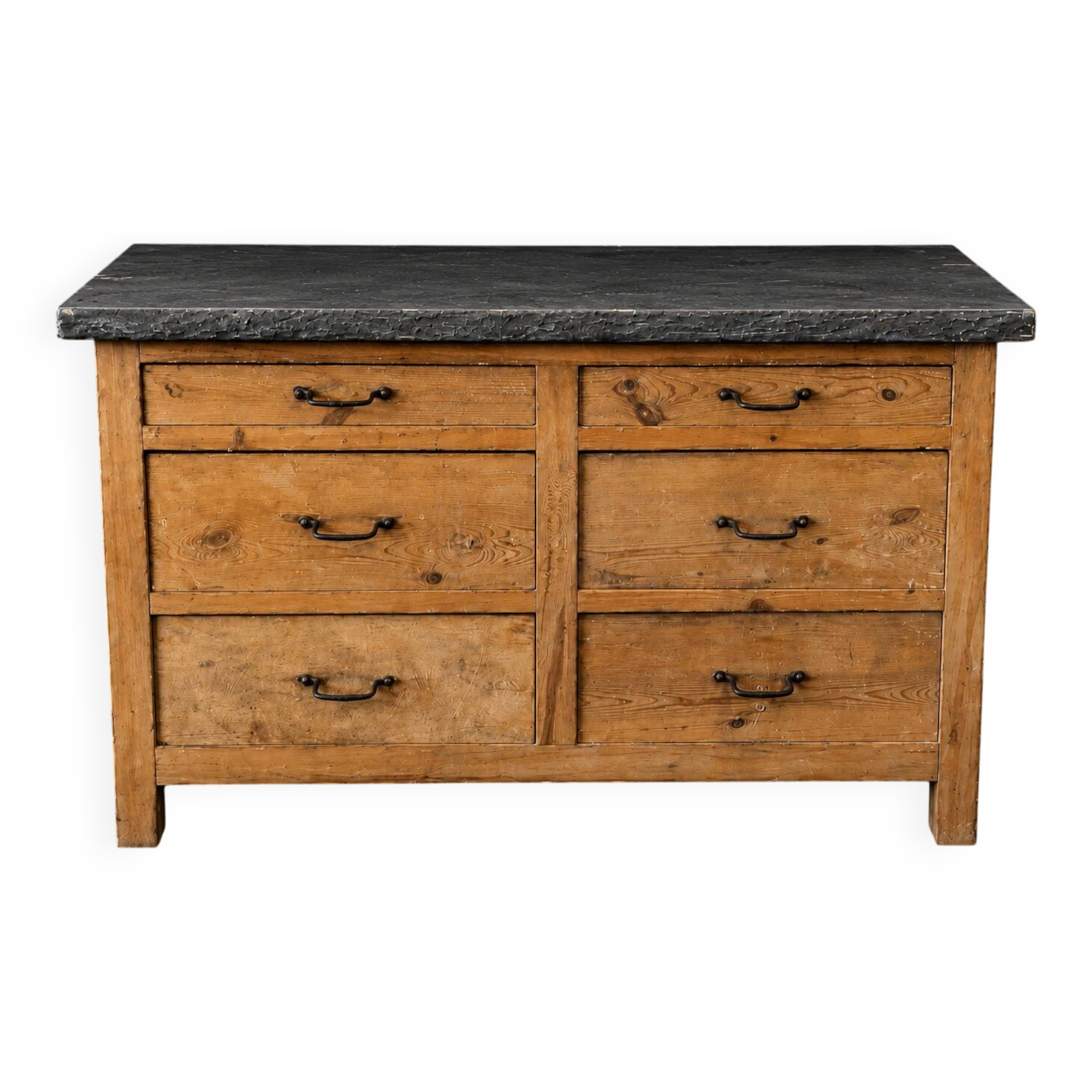Old wooden workshop furniture with a stone top.
