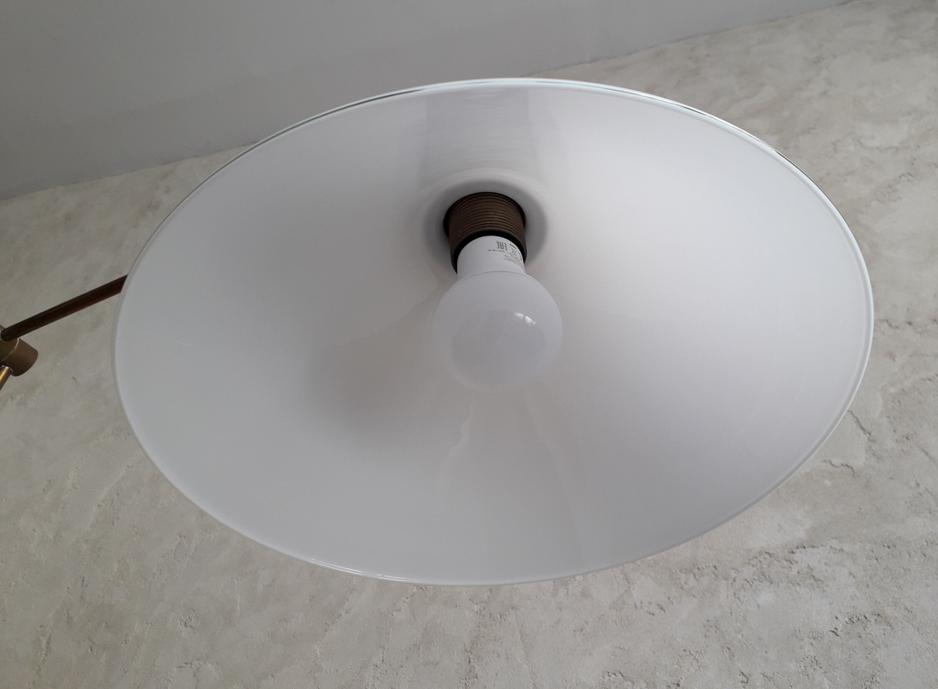 Articulated brass floor lamp