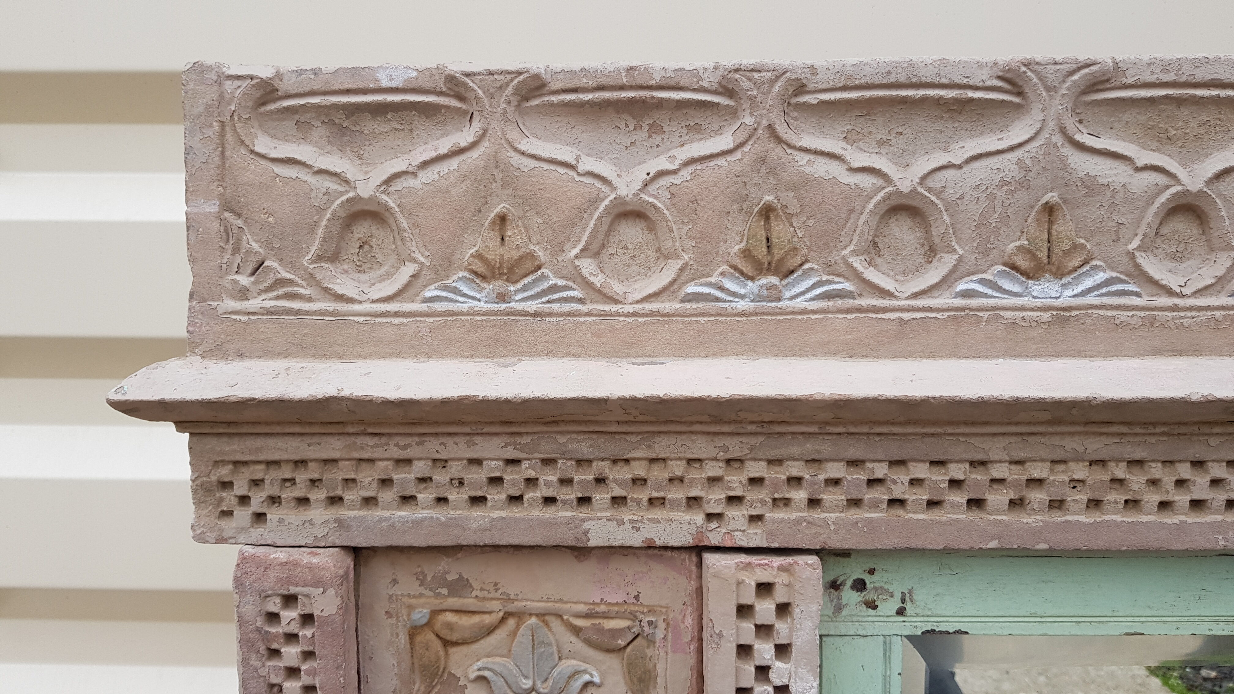 Fully hand-carved stone window with mirror