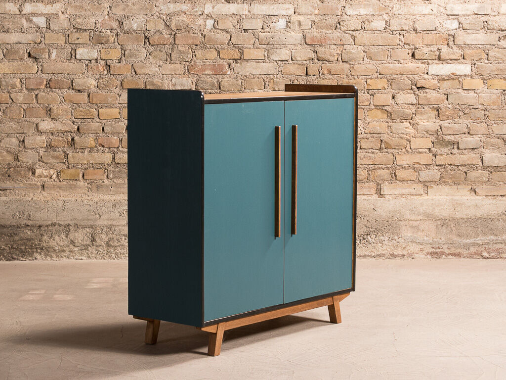 Vintage low sideboard restyled in blue with 2 swing doors and wooden base