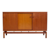 Modern mid-century teak sideboard with brass details.
