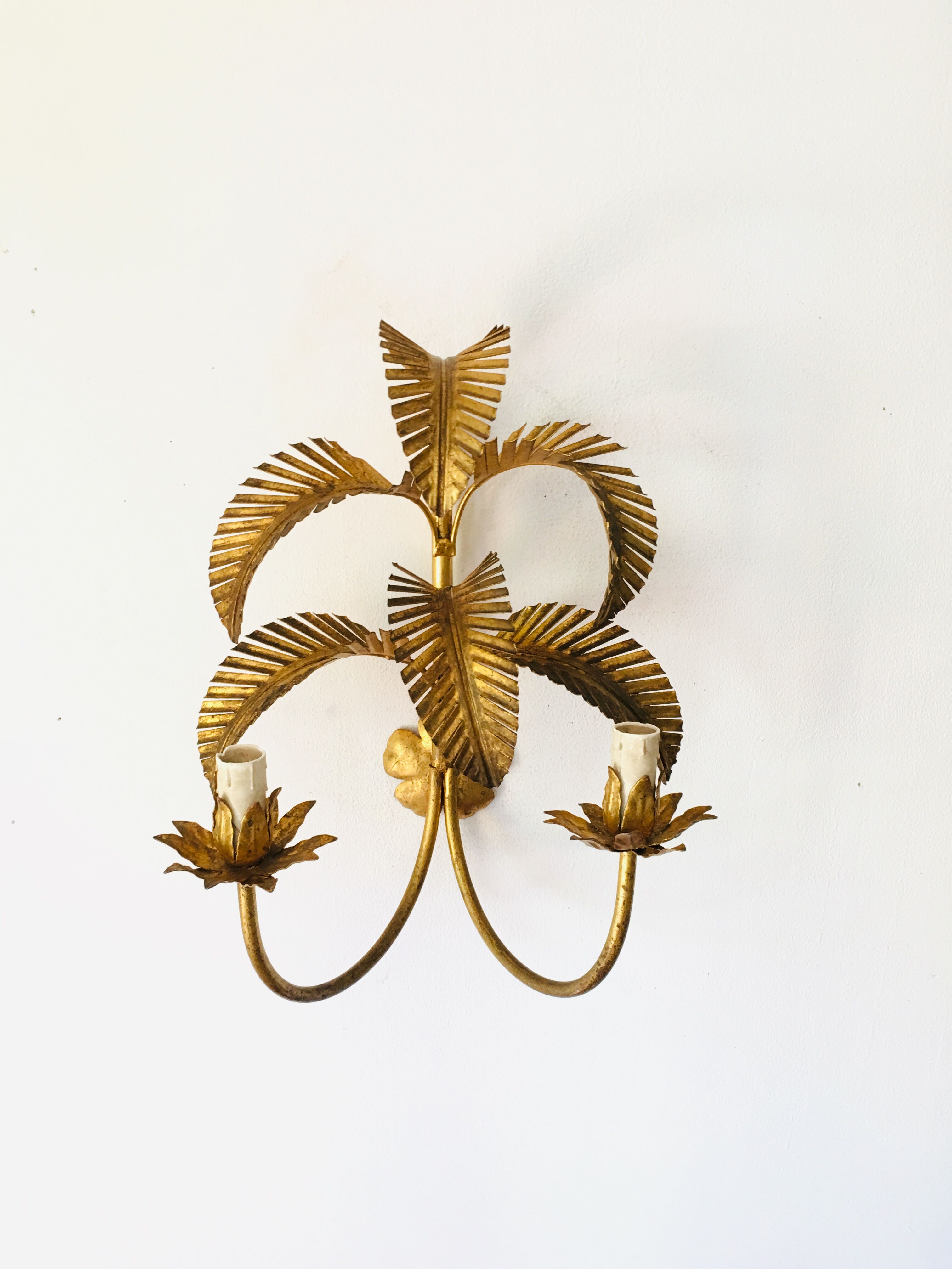 Golden palm leaf sconce