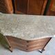 Curved chest of drawers in rosewood and marble marquetry