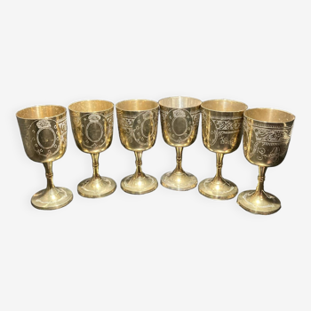 Set of six gold metal glasses