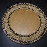 Vintage round mirror in a wicker frame