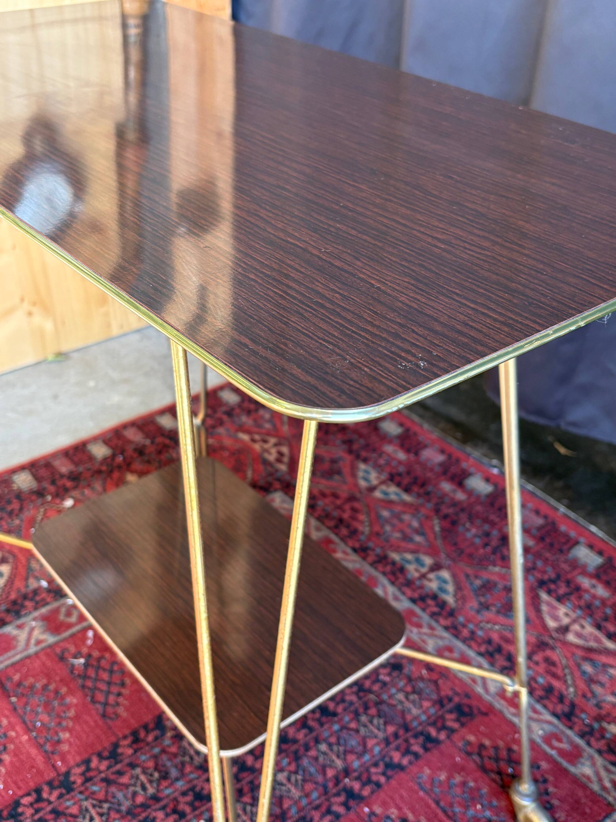 Vintage 1960s rolling dessert trolley in gold metal and formica.