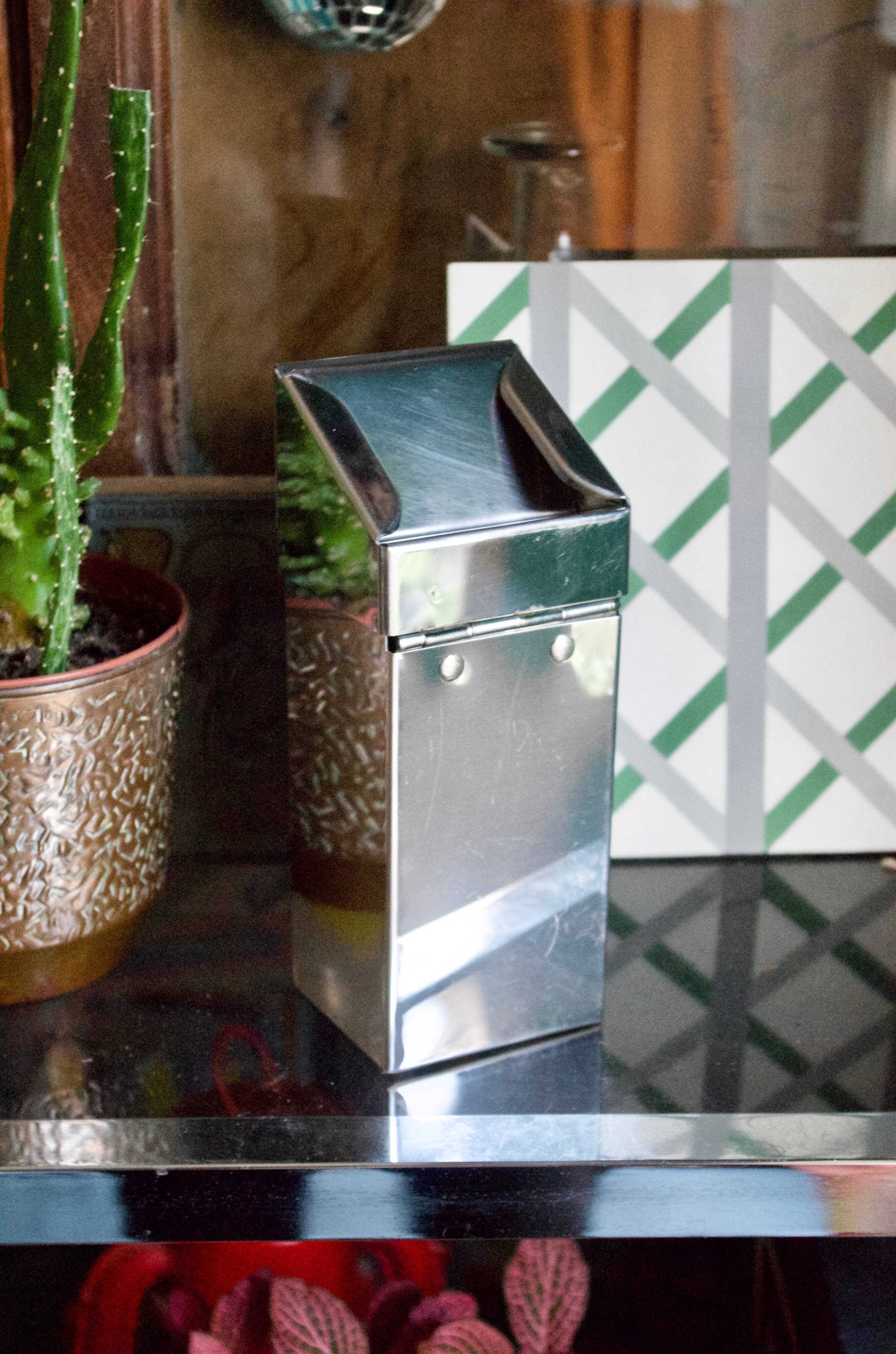Vintage wall ashtray in shiny metal industrial style