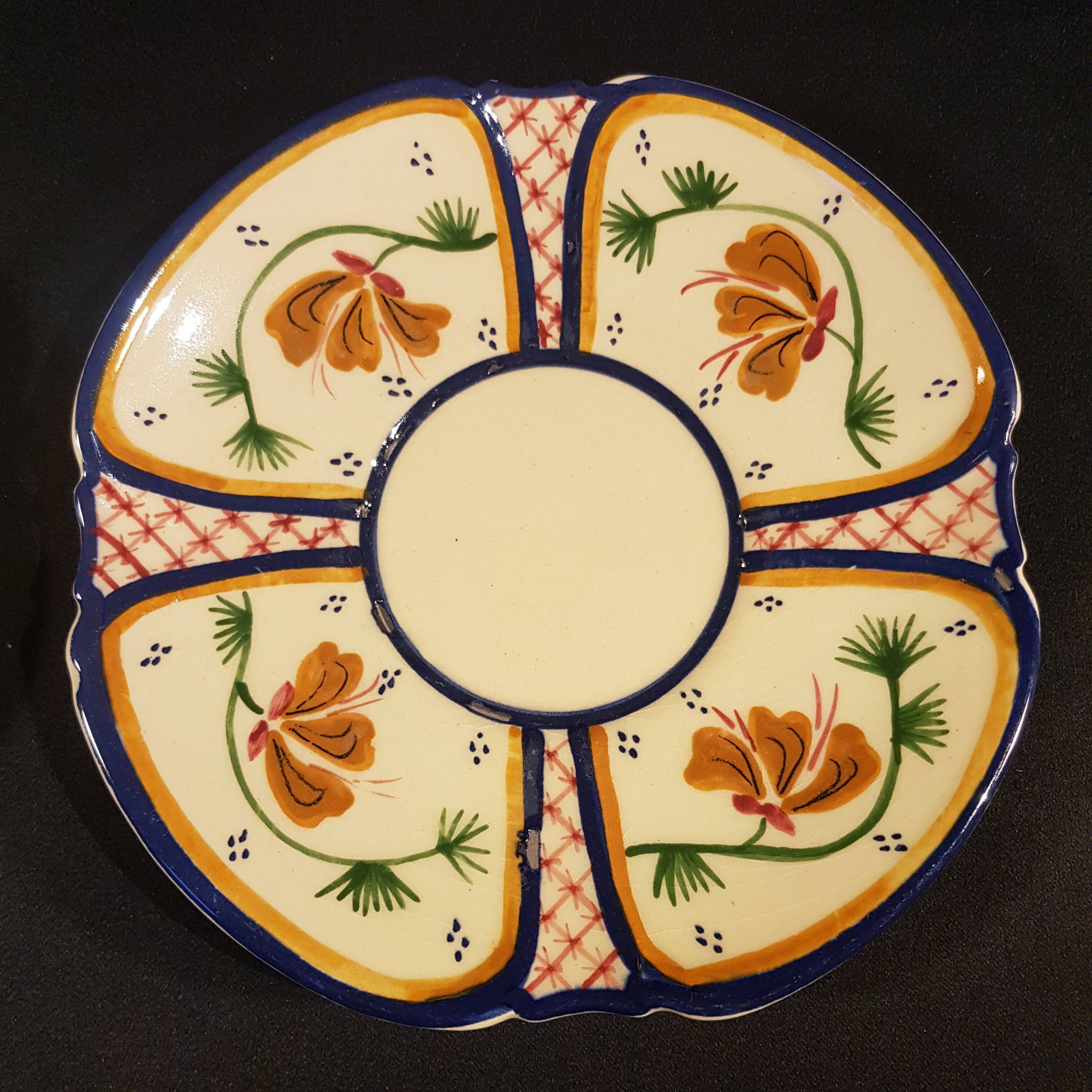 4 Quimper earthenware saucers or plates