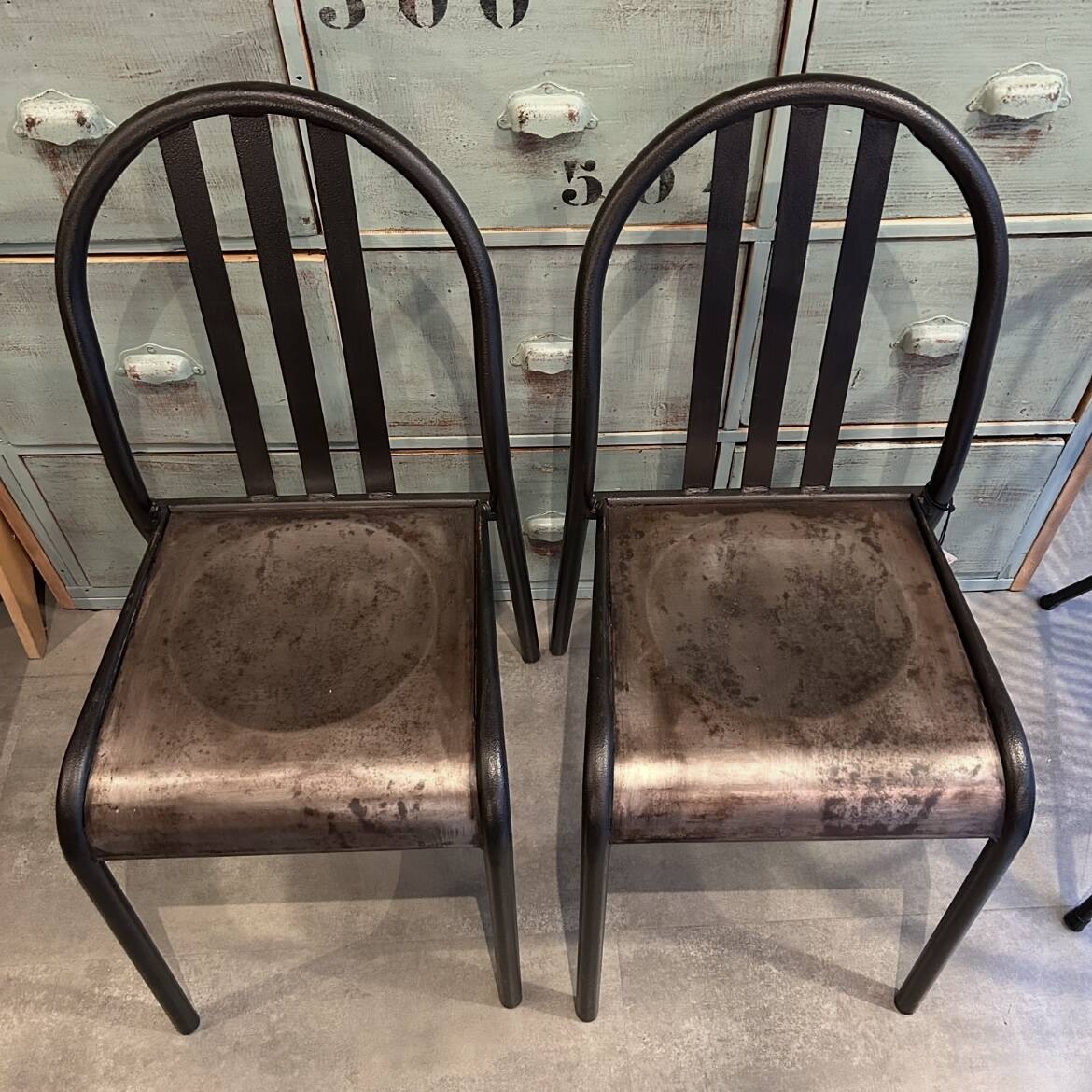 Two vintage slatted chairs.